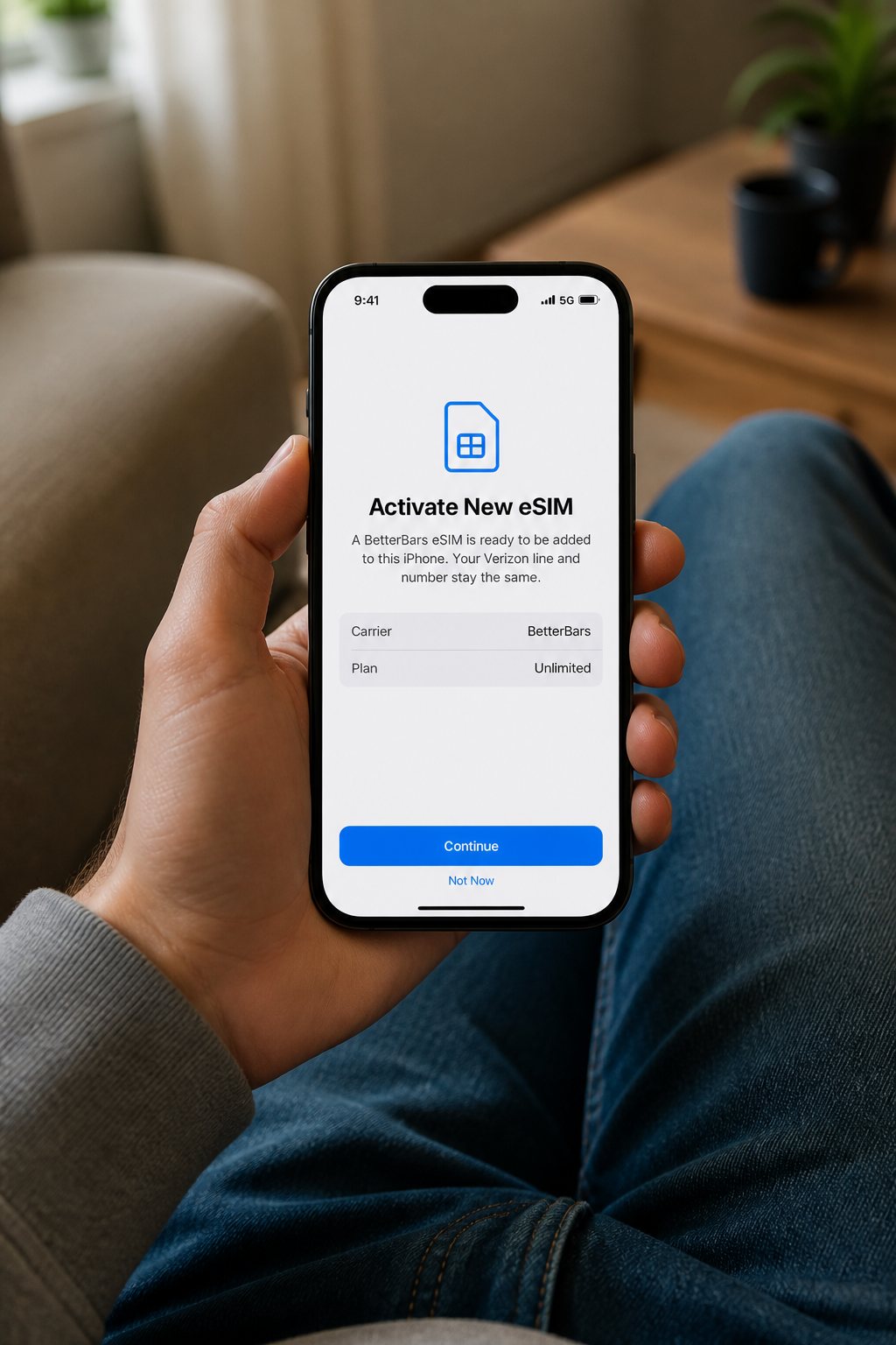 Someone on a couch adding an eSIM to their phone